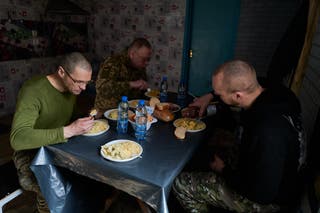 Servicemen of the 155th Brigade of the Armed Forces of Ukraine have a lunch break at their headquarter on the frontline near Pokrovsk